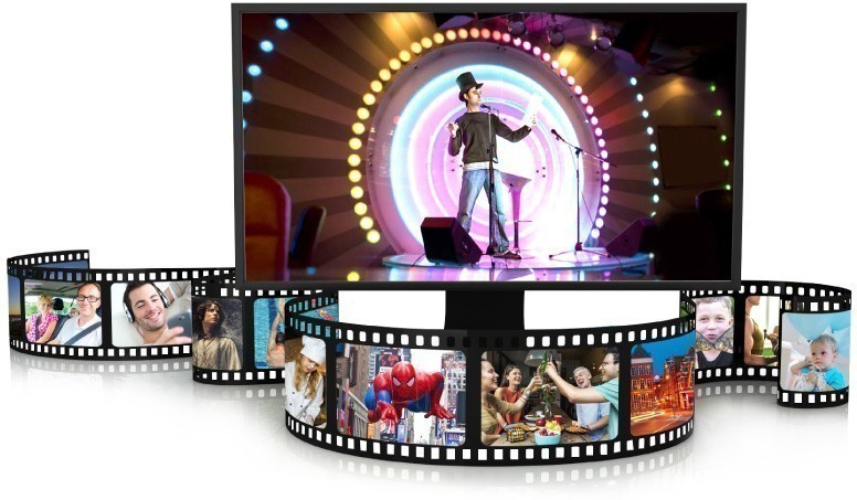 Rolls of film surround TV with video of performer